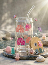 TheNStudio glass tumbler with pastel rainbow design, bamboo lid, and glass straw. Features butterflies and cute charms.