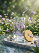 TheNStudio glass tumbler with bamboo lid and straw, adorned with purple butterfly prints. Includes reusable glass straw and cleaner.